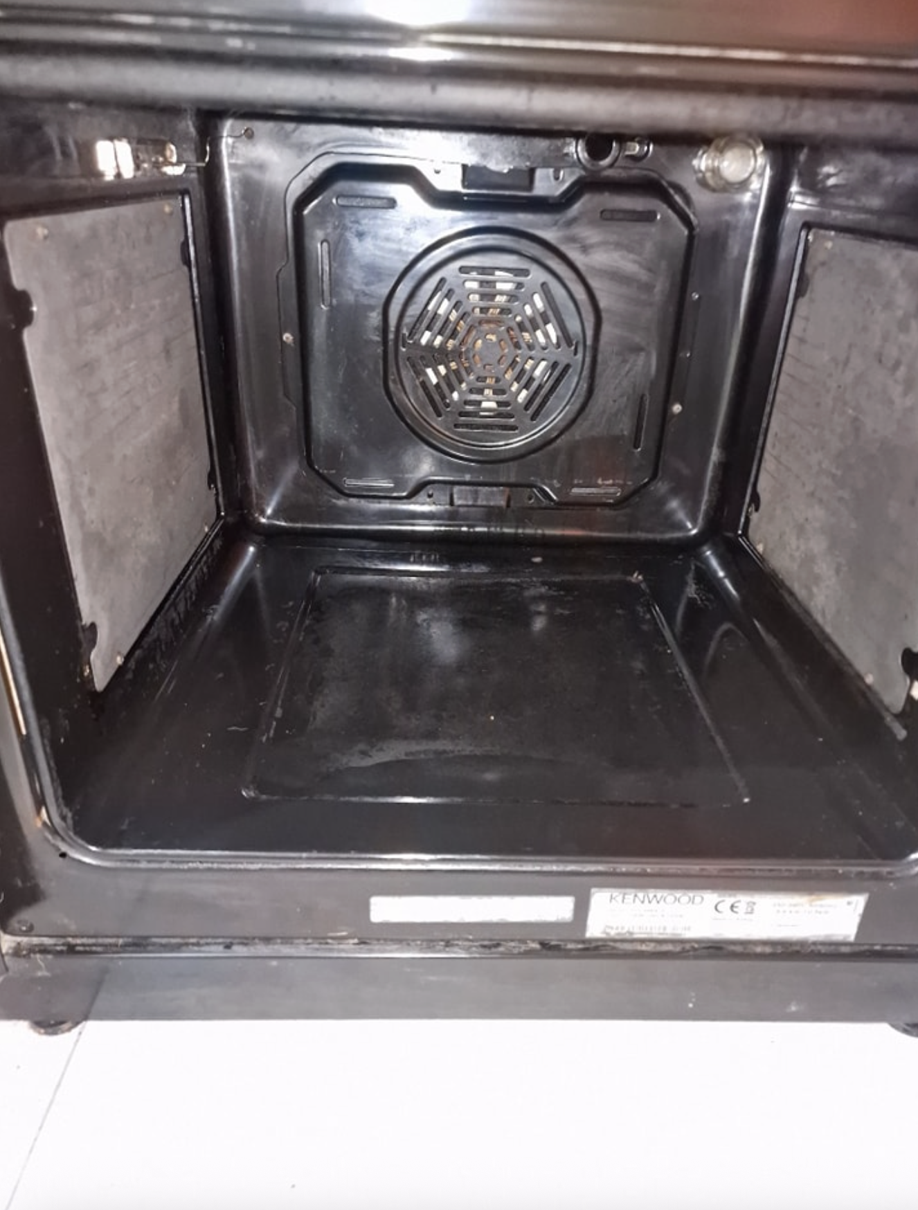 Oven interior after cleaning — clean black oven cavity