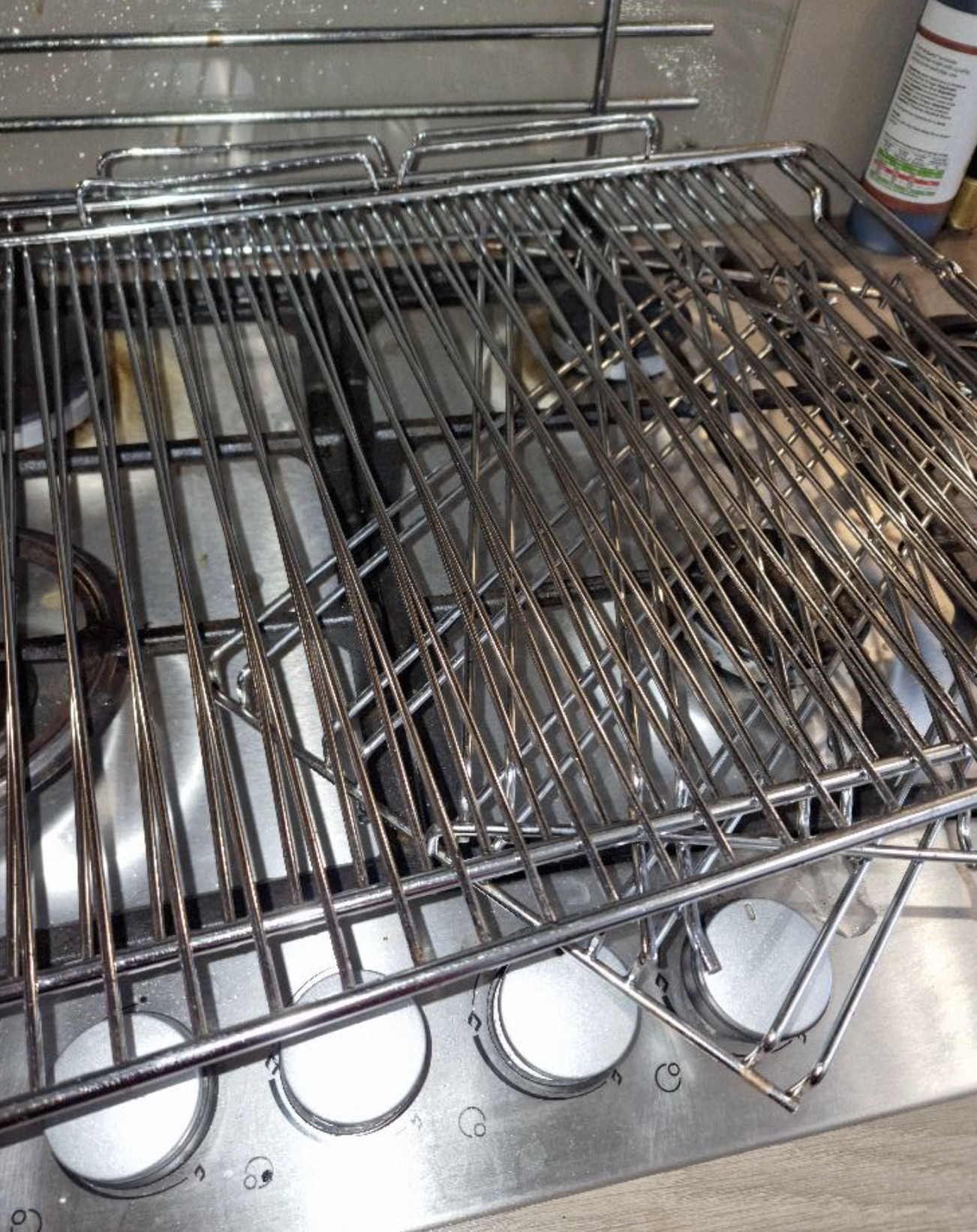 Oven rack after cleaning — metal restored to bright silver